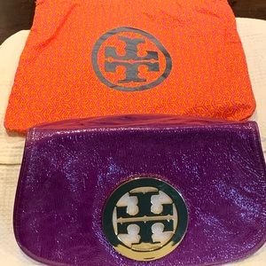 Tory Burch Clutch bag, purple color. Pre-owned but not used. Gold hardware.